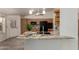 Spacious kitchen with black appliances, wood cabinets, and granite countertops at 7839 E Milagro Ave, Mesa, AZ 85209