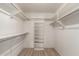 A large walk-in closet with built-in shelving at 7839 E Milagro Ave, Mesa, AZ 85209