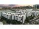 View of the complex set against the waterway, with modern buildings and visible parking at 945 E Playa Del Norte Dr # 4019, Tempe, AZ 85288