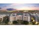 Aerial view of luxury apartments with lake access at dusk at 945 E Playa Del Norte Dr # 4019, Tempe, AZ 85288