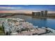 Stunning aerial view showcasing the building's rooftop with water views and the city skyline at sunset at 945 E Playa Del Norte Dr # 4019, Tempe, AZ 85288