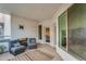 Spacious balcony with comfortable seating area, television mount, and view of bedroom at 945 E Playa Del Norte Dr # 4019, Tempe, AZ 85288