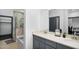 Contemporary bathroom with double vanity, stone countertop, and glass-enclosed shower at 945 E Playa Del Norte Dr # 4019, Tempe, AZ 85288