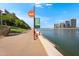 Waterfront walking path and view of North Bank Boat Landing, with luxury apartments in the background at 945 E Playa Del Norte Dr # 4019, Tempe, AZ 85288