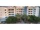 View of the building's exterior featuring private balconies and palm tree landscaping at 945 E Playa Del Norte Dr # 4019, Tempe, AZ 85288