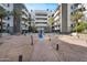 Beautiful courtyard with mature trees, ample seating and manicured landscaping creates a serene outdoor retreat at 945 E Playa Del Norte Dr # 4019, Tempe, AZ 85288