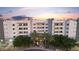 Exterior shot of luxury apartments with palm trees and manicured landscaping creates an inviting and elegant facade at 945 E Playa Del Norte Dr # 4019, Tempe, AZ 85288