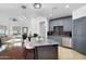 Modern kitchen with stainless steel appliances, a gray kitchen island, and dark wood flooring at 945 E Playa Del Norte Dr # 4019, Tempe, AZ 85288