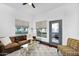 Inviting living room with modern decor, plush seating, and access to a private balcony at 945 E Playa Del Norte Dr # 4019, Tempe, AZ 85288