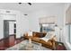 Inviting living room with a leather sofa, glass coffee table, and a large window offering natural light at 945 E Playa Del Norte Dr # 4019, Tempe, AZ 85288