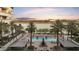 Inviting pool area with a fireplace, cabanas and palm trees provides a perfect setting for relaxation at 945 E Playa Del Norte Dr # 4019, Tempe, AZ 85288