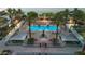 Overhead shot of an inviting pool area featuring a fireplace, shade cabanas and lounge chairs at 945 E Playa Del Norte Dr # 4019, Tempe, AZ 85288