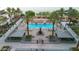 Inviting pool area features a hot tub, fireplace, and seating areas surrounded by mature palm trees and lush landscaping at 945 E Playa Del Norte Dr # 4019, Tempe, AZ 85288