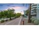 Scenic walking path near the building features lush landscaping and lake views at 945 E Playa Del Norte Dr # 4019, Tempe, AZ 85288