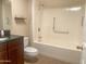 Bathroom with vanity, toilet, and walk-in shower at 9708 W Redwood Dr, Sun City, AZ 85351