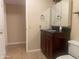 Bathroom featuring vanity, toilet, and storage at 9708 W Redwood Dr, Sun City, AZ 85351