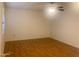 Bedroom with a ceiling fan, laminate flooring, and light coming in through the window at 9708 W Redwood Dr, Sun City, AZ 85351