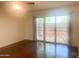 Bedroom with wooden floor and glass sliding door at 9708 W Redwood Dr, Sun City, AZ 85351