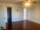Bedroom with wood floors, ceiling fan, and closet at 9708 W Redwood Dr, Sun City, AZ 85351
