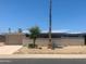 Charming single-story home featuring desert landscaping, brick accents, and a private courtyard wall at 9708 W Redwood Dr, Sun City, AZ 85351