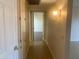 Hallway displaying tile flooring and decorative lighting fixtures at 9708 W Redwood Dr, Sun City, AZ 85351