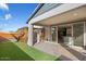 Backyard with an outdoor seating area and a sliding glass door to the kitchen at 10013 E Trent Ave, Mesa, AZ 85212