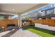 Inviting backyard with a paved patio, swing, and lush green lawn at 10013 E Trent Ave, Mesa, AZ 85212