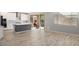 Modern kitchen with white cabinets, stainless steel appliances, and center island at 10013 E Trent Ave, Mesa, AZ 85212