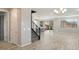 Bright living room featuring hardwood floors, large windows, and modern lighting at 10013 E Trent Ave, Mesa, AZ 85212