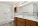 Bright bathroom showcasing a vanity, a tub-shower with tile surround, and updated fixtures at 11360 E Keats Ave # 92, Mesa, AZ 85209