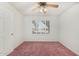 Bedroom featuring plantation shutters, neutral walls, ceiling fan and carpet at 11360 E Keats Ave # 92, Mesa, AZ 85209