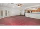 Spacious living room featuring carpet, white walls, and natural light at 11360 E Keats Ave # 92, Mesa, AZ 85209