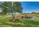 Beautiful golf course water feature with rocky waterfall and surrounding greenery on a sunny day at 11360 E Keats Ave # 92, Mesa, AZ 85209