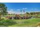 Scenic golf course water feature with rock waterfalls and lush green landscaping under a bright blue sky at 11360 E Keats Ave # 92, Mesa, AZ 85209