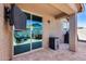 Inviting backyard patio featuring an outdoor sitting area for relaxing and entertaining at 12211 W Hide Trl, Peoria, AZ 85383