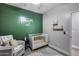 Modern Bedroom design with green accent wall, decor, and minimalist shelving at 12211 W Hide Trl, Peoria, AZ 85383