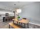 Dining area adjacent to the kitchen offers a seamless transition for modern living at 12211 W Hide Trl, Peoria, AZ 85383
