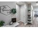 Inviting entryway features neutral walls, decorative accents, and wood-look flooring at 12211 W Hide Trl, Peoria, AZ 85383