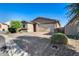 Attractive single-Gathering home with a paved driveway, desert landscaping, and a two-car garage at 12211 W Hide Trl, Peoria, AZ 85383