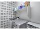 Laundry room featuring modern appliances and a convenient storage shelf above at 12211 W Hide Trl, Peoria, AZ 85383