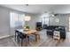 Bright living and dining area with stylish furnishings and neutral tones offering a comfortable living space at 12211 W Hide Trl, Peoria, AZ 85383