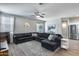 Bright living room features a modern couch, stylish decor, and lots of natural light at 12211 W Hide Trl, Peoria, AZ 85383