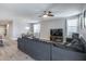 Spacious open-concept living room adjacent to the dining area for effortless entertaining at 12211 W Hide Trl, Peoria, AZ 85383