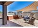 Outdoor patio with a hot tub, seating area, and shade cover at 12211 W Hide Trl, Peoria, AZ 85383