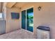 Covered patio with tile flooring and sliding glass doors to backyard at 12211 W Hide Trl, Peoria, AZ 85383
