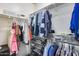 Organized walk-in closet with ample hanging space and shelving for storage at 12211 W Hide Trl, Peoria, AZ 85383
