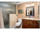Bathroom featuring granite counters, a wooden vanity, plus a glass enclosed shower at 12826 W Maplewood Dr, Sun City West, AZ 85375