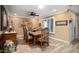 Formal dining room with wood floors and decorative upholstered chairs at 12826 W Maplewood Dr, Sun City West, AZ 85375