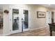 Hallway with glass doors leading to the outdoor patio and seating area at 12826 W Maplewood Dr, Sun City West, AZ 85375