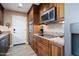 Kitchen featuring stainless appliances, granite countertops, and wood floors at 12826 W Maplewood Dr, Sun City West, AZ 85375